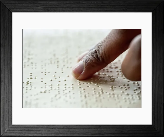 Framed Print : Woman reading braille text from book Framed Print : Woman reading braille text from book