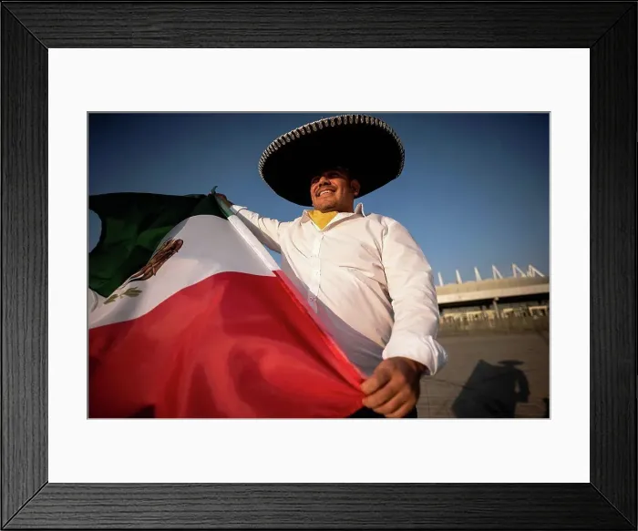 Framed Print : Smiling man wearing sombrero holding Mexican flag on sunny day