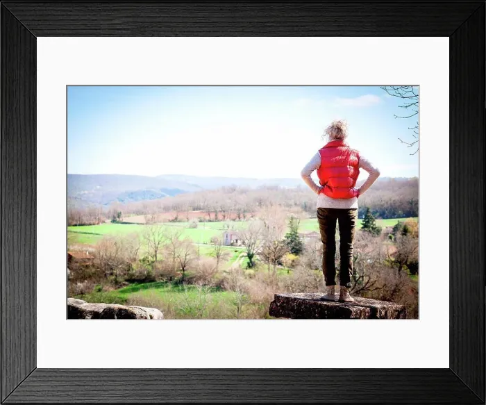 Framed Print : Rear view of woman looking away at elevated view, Bruniquel, France