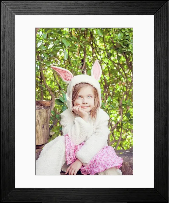 Framed Print : Portrait of little girl wearing Easter bunny costume Framed Print : Portrait of little girl wearing Easter bunny costume