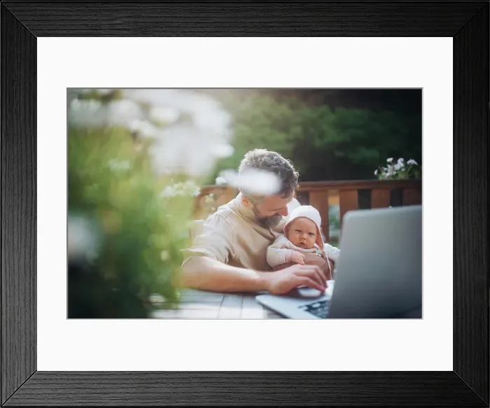 Framed Print : Dad working from homeoffice, sitting on patio with laptop Framed Print : Dad working from homeoffice, sitting on patio with laptop