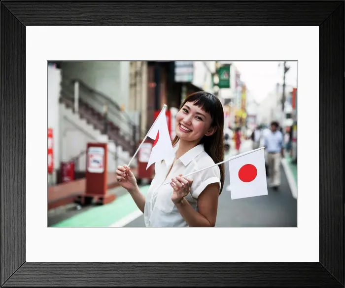 Framed Print : Smiling Japanese woman with long brown hair wearing white short-sleeved blouse standing in a street Framed Print : Smiling Japanese woman with long brown hair wearing white short-sleeved blouse standing in a street