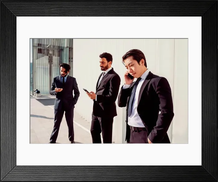 Framed Print : Mixed race group of businessmen hanging out together in town Framed Print : Mixed race group of businessmen hanging out together in town