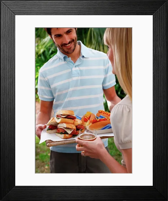 Framed Print : Man holding tray of burgers and hot dogs Framed Print : Man holding tray of burgers and hot dogs