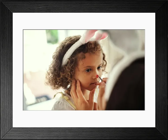 Framed Print : Girl, face paint and bunny ears for Easter