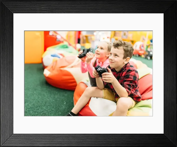 Framed Print : Couple at the showcase choosing helmets for ski or snowboarding
