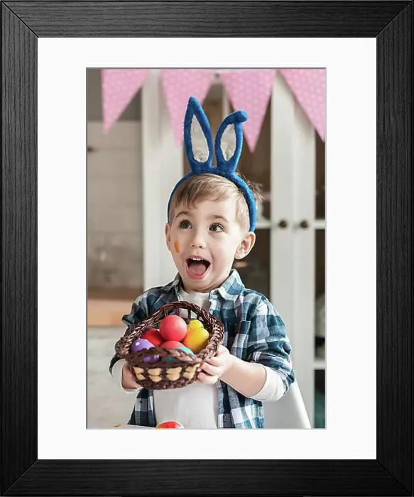 Framed Print : Adorable little boy holding basket with easter eggs Framed Print : Adorable little boy holding basket with easter eggs
