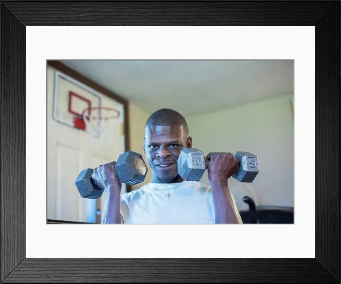 Framed Print : Man with Williams Syndrome exercising Framed Print : Man with Williams Syndrome exercising