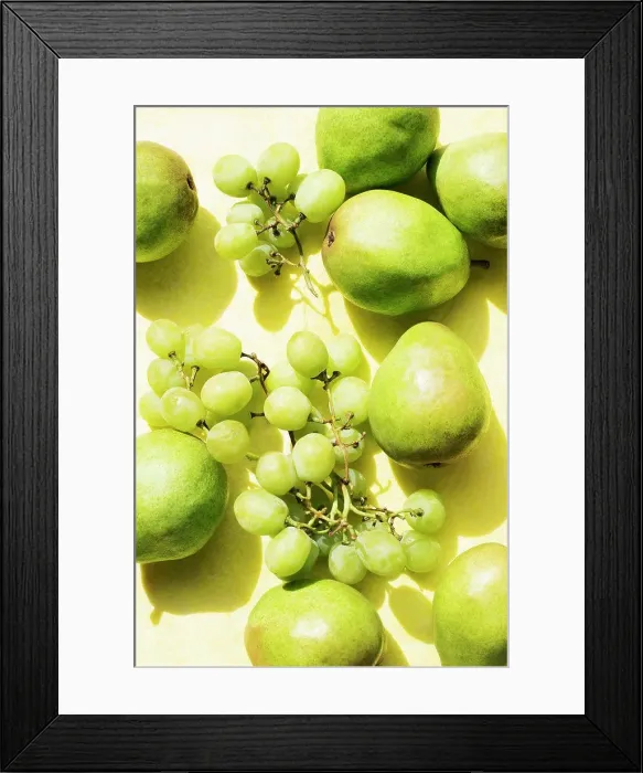 Framed Print : Overhead view of pears and grapes on yellow table cloth