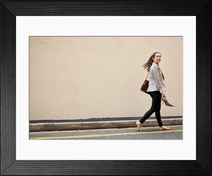Framed Print : Woman in street, walking at wall with mockup and barefoot Framed Print : Woman in street, walking at wall with mockup and barefoot