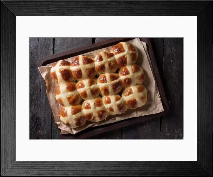 Framed Print : Homemade Easter traditional hot cross buns on oven tray with baking paper over dark wooden background. Top view, space Framed Print : Homemade Easter traditional hot cross buns on oven tray with baking paper over dark wooden background. Top view, space