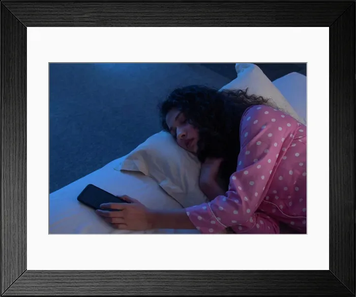 Framed Print : A TEENAGE GIRL SLEEPING WITH PHONE IN HAND Framed Print : A TEENAGE GIRL SLEEPING WITH PHONE IN HAND