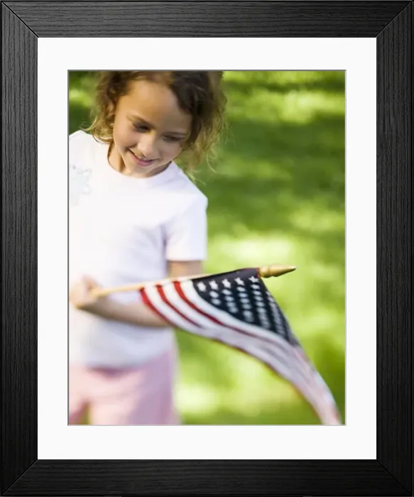 Framed Print : Girl holding US flag