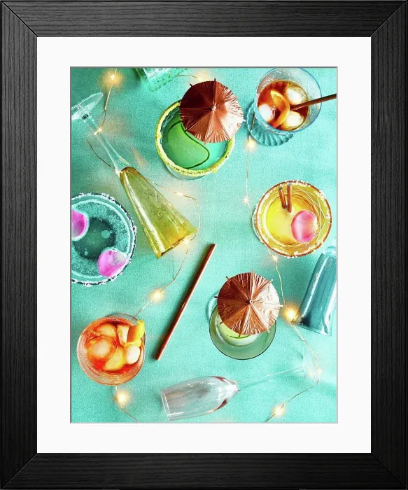 Framed Print : Decorative lights and party cocktails