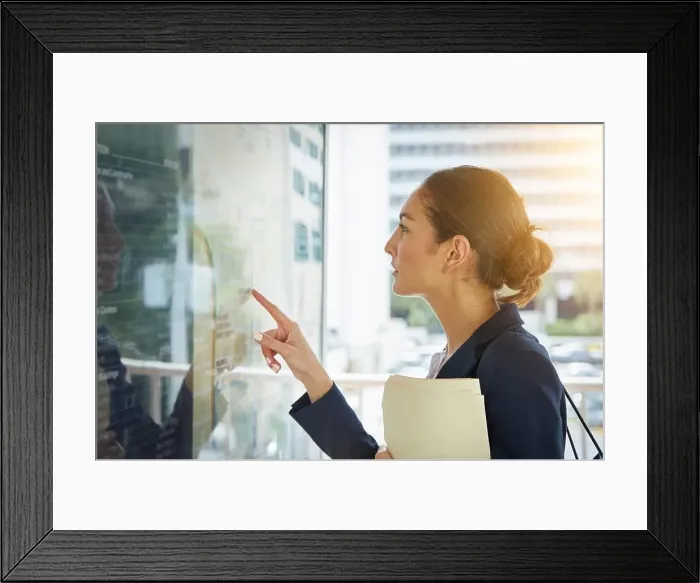 Framed Print : Finding the quickest route to commute. a businesswoman reading a route schedule while on the way to work Framed Print : Finding the quickest route to commute. a businesswoman reading a route schedule while on the way to work