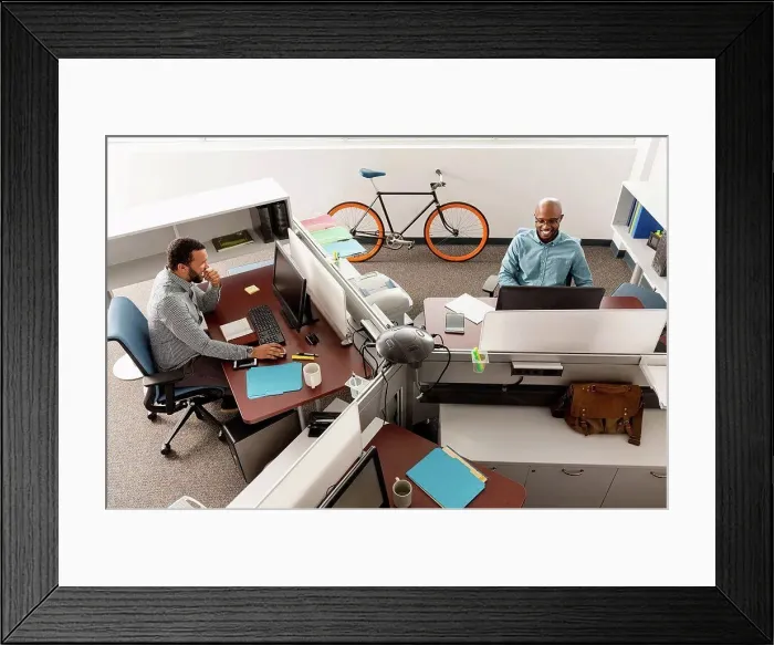 Framed Print : Men working at computers in office