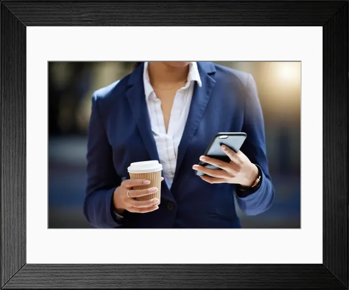 Framed Print : Coffee break and phone in hands of a business woman reading email