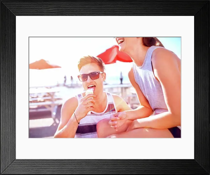 Framed Print : Couple with ice cream smiling Framed Print : Couple with ice cream smiling