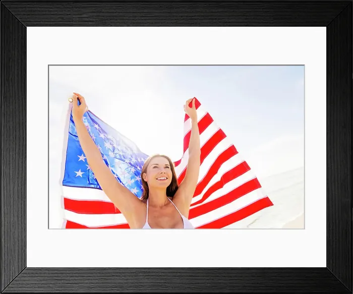 Framed Print : Woman holding American flag