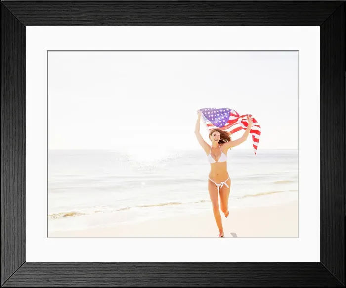 Framed Print : Woman holding American flag Framed Print : Woman holding American flag