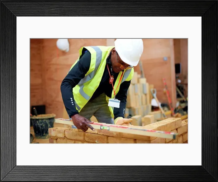 Framed Print : Lecturer building brick wall in classroom Framed Print : Lecturer building brick wall in classroom