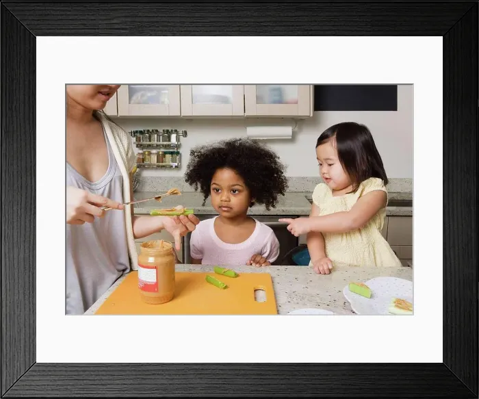 Framed Print : A mother making food for children Framed Print : A mother making food for children