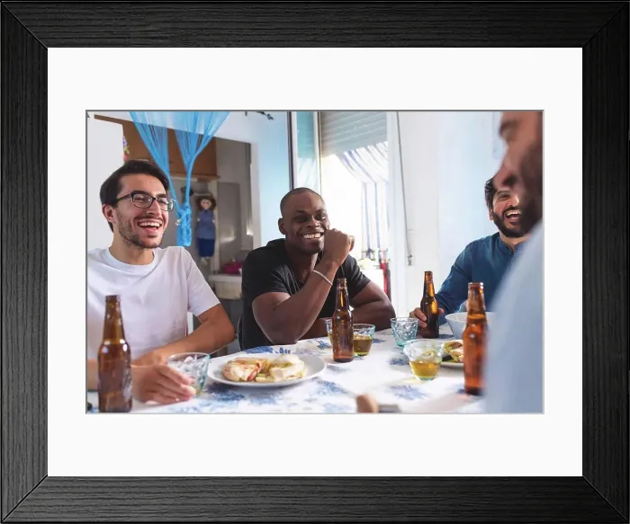 Framed Print : Male friends socialising with food and beer Framed Print : Male friends socialising with food and beer