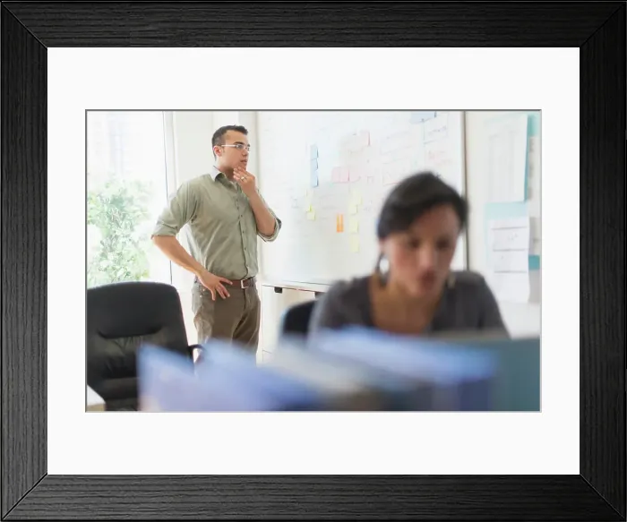 Framed Print : Two people working in office