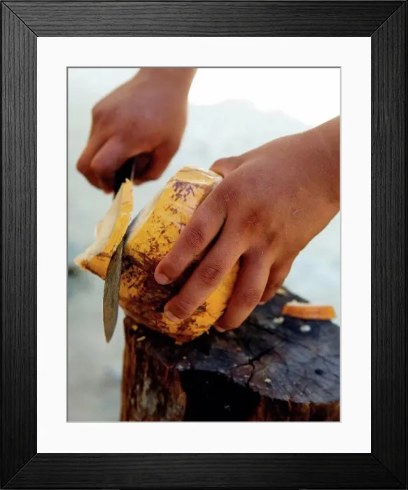 Framed Print : Man cutting coconut Framed Print : Man cutting coconut