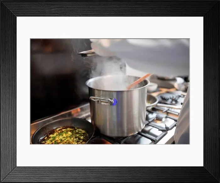 Framed Print : Chef preparing food in restaurant kitchen Framed Print : Chef preparing food in restaurant kitchen