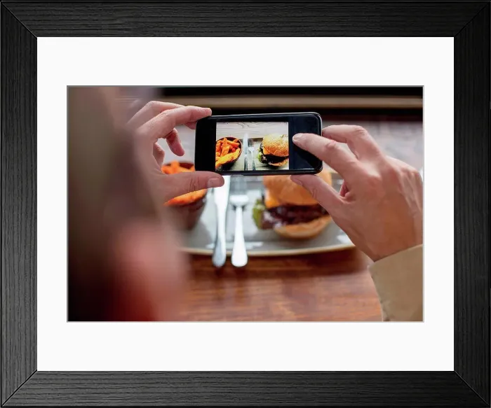 Framed Print : Man photographing food with smartphone Framed Print : Man photographing food with smartphone