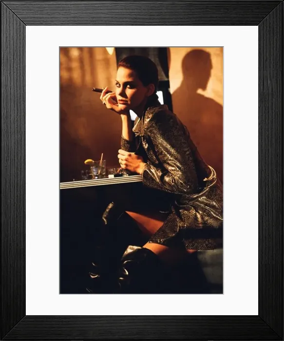 Framed Print : Young woman smoking a cigar in a bar Framed Print : Young woman smoking a cigar in a bar