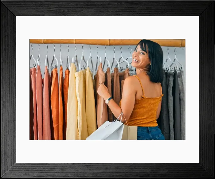 Framed Print : Shopping, fashion and smile, woman at designer clothing boutique with bag and happy face Framed Print : Shopping, fashion and smile, woman at designer clothing boutique with bag and happy face