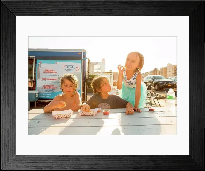 Framed Print : Group of children eating fast food beside fast food trailer Framed Print : Group of children eating fast food beside fast food trailer
