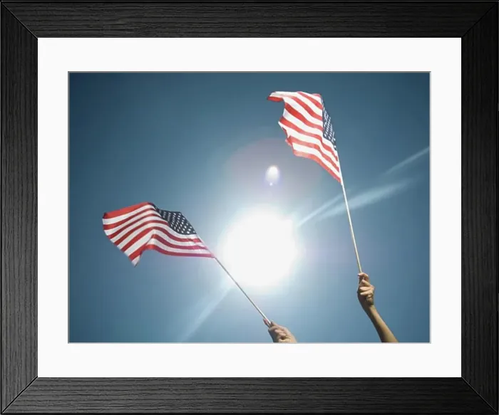 Framed Print : Woman holding American flags Framed Print : Woman holding American flags