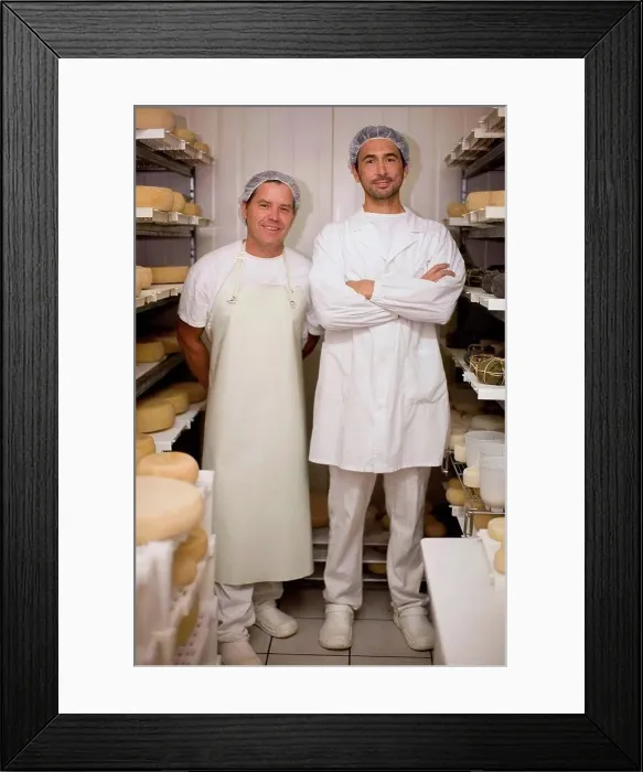 Framed Print : Worker at a cheese dairy Framed Print : Worker at a cheese dairy