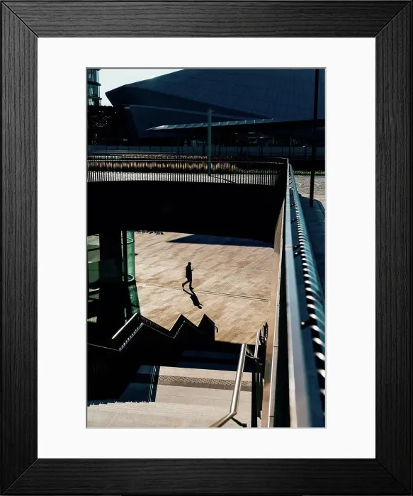 Framed Print : Mature businessman walking outdoors, elevated view Framed Print : Mature businessman walking outdoors, elevated view