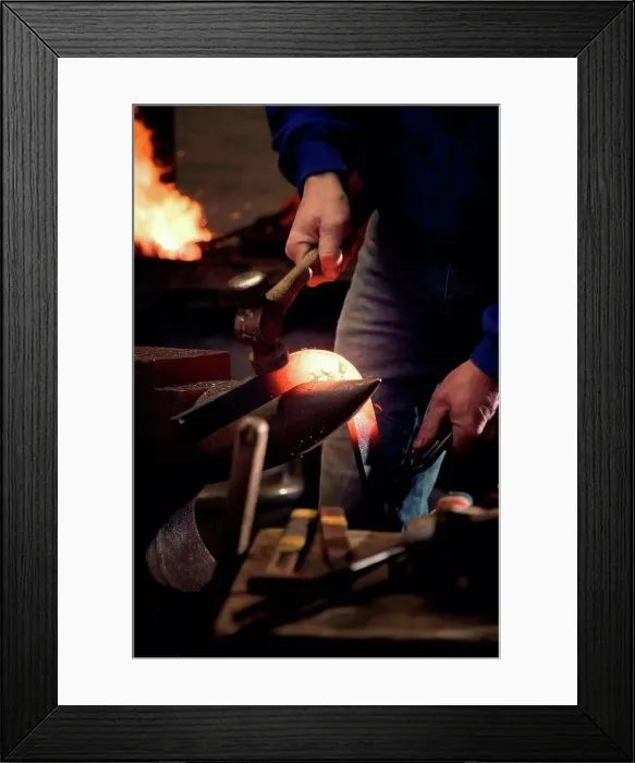 Framed Print : Farrier forging horseshoe on anvil