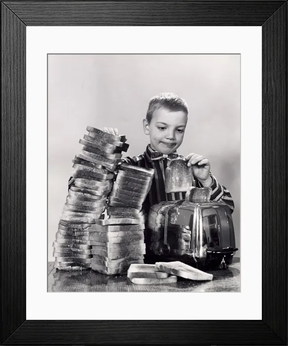 Framed Print : Boy making toast