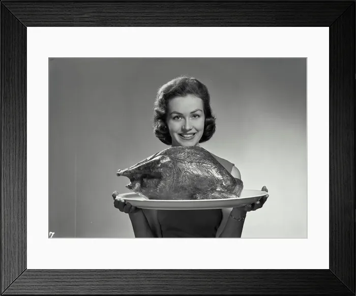Framed Print : Vintage Photograph. Lucy Cort. Model Released. Portrait of woman in sleeveless blouse holding turkey Framed Print : Vintage Photograph. Lucy Cort. Model Released. Portrait of woman in sleeveless blouse holding turkey