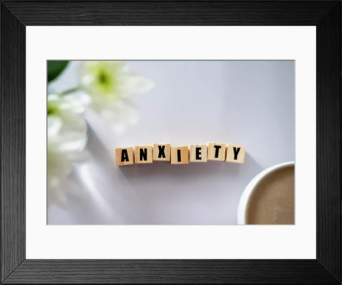 Framed Print : Wooden block with word ANXIETY. Mental health concept Framed Print : Wooden block with word ANXIETY. Mental health concept