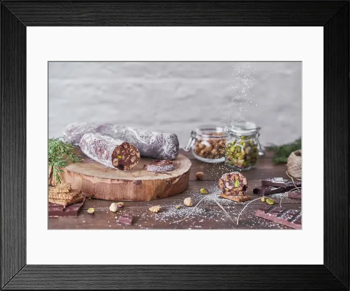 Framed Print : Chocolate salami with nuts on wooden table
