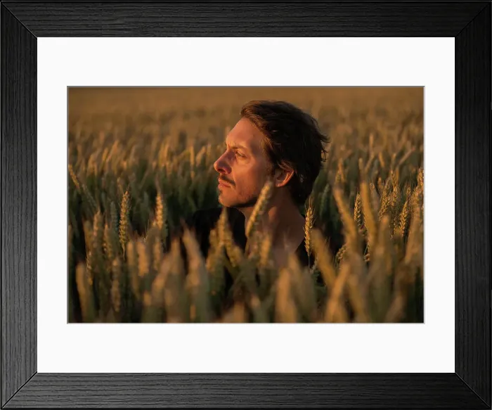 Framed Print : Concerned Male in His Thirties is Looking At the Light Away At Sunset Framed Print : Concerned Male in His Thirties is Looking At the Light Away At Sunset