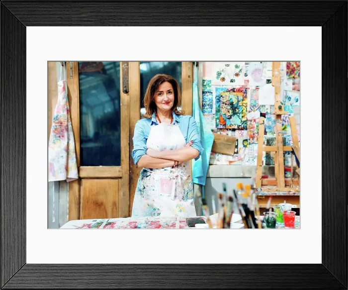 Framed Print : Portrait of female artist in creative studio, smiling Framed Print : Portrait of female artist in creative studio, smiling