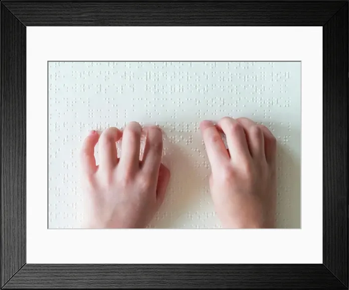 Framed Print : Hands of a blind child reading braille Framed Print : Hands of a blind child reading braille