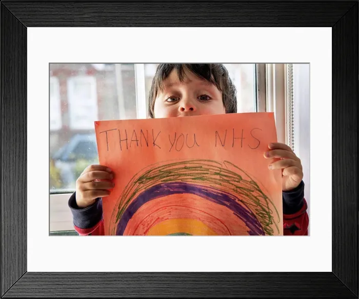 Framed Print : A boy holding up a drawing of a rainbow with the words Thank You NHS Framed Print : A boy holding up a drawing of a rainbow with the words Thank You NHS