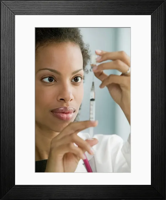Framed Print : Doctor preparing syringe