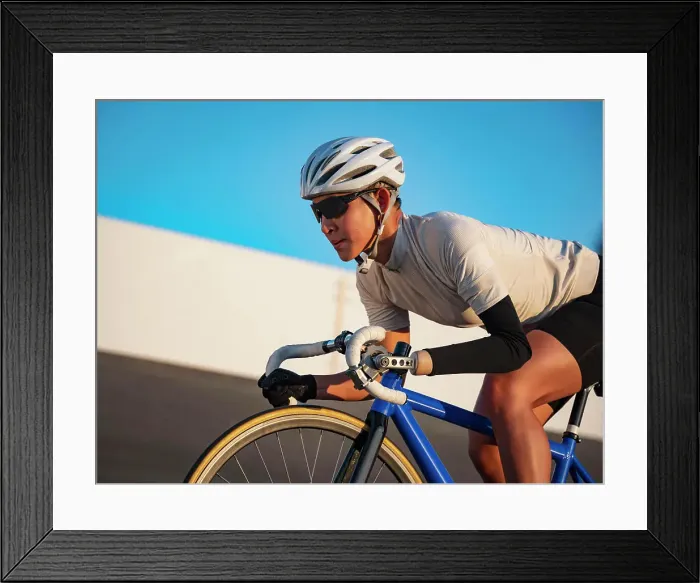 Framed Print : Athletic woman with prosthetic arm riding bicycle Framed Print : Athletic woman with prosthetic arm riding bicycle