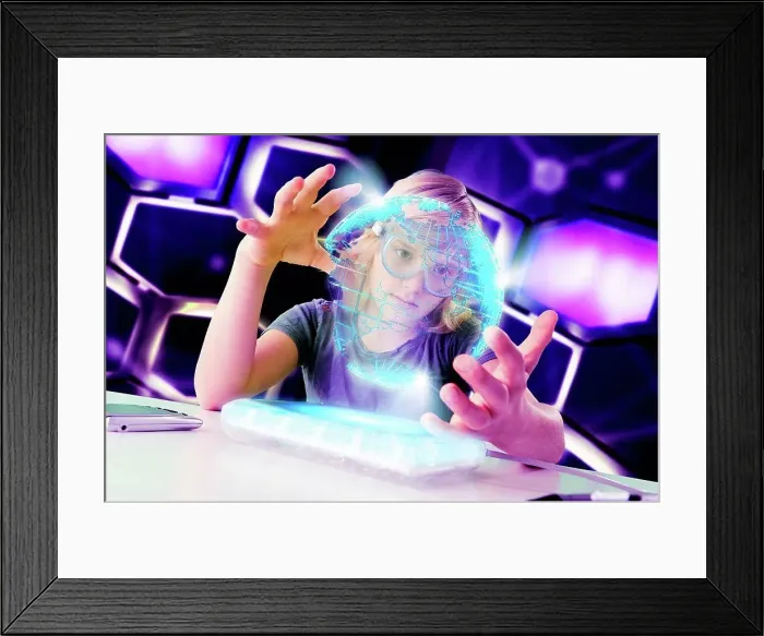 Framed Print : Boy interacting with floating digital globe Framed Print : Boy interacting with floating digital globe