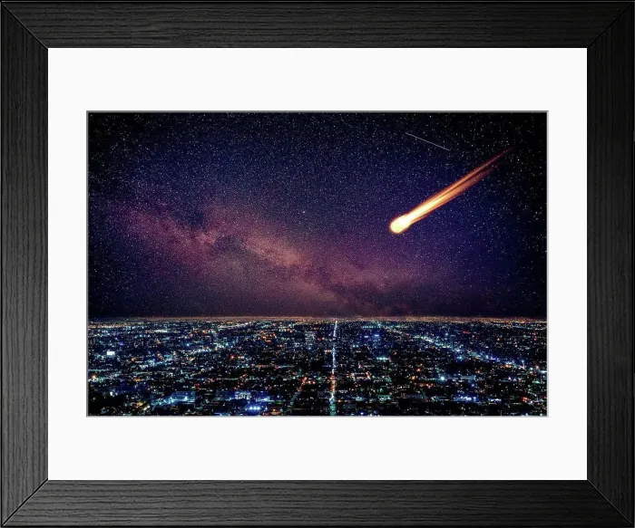 Framed Print : Meteor in night sky falling over illuminated cityscape